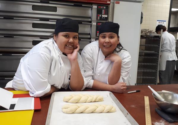 Students braiding bread