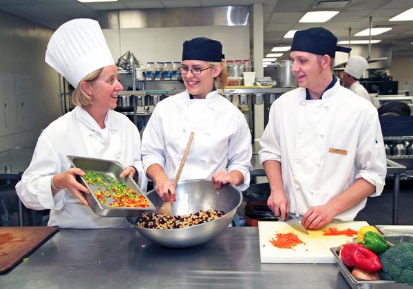 Students and teachers mixing fresh ingredients