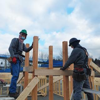 Two carpentry students doing framing. 